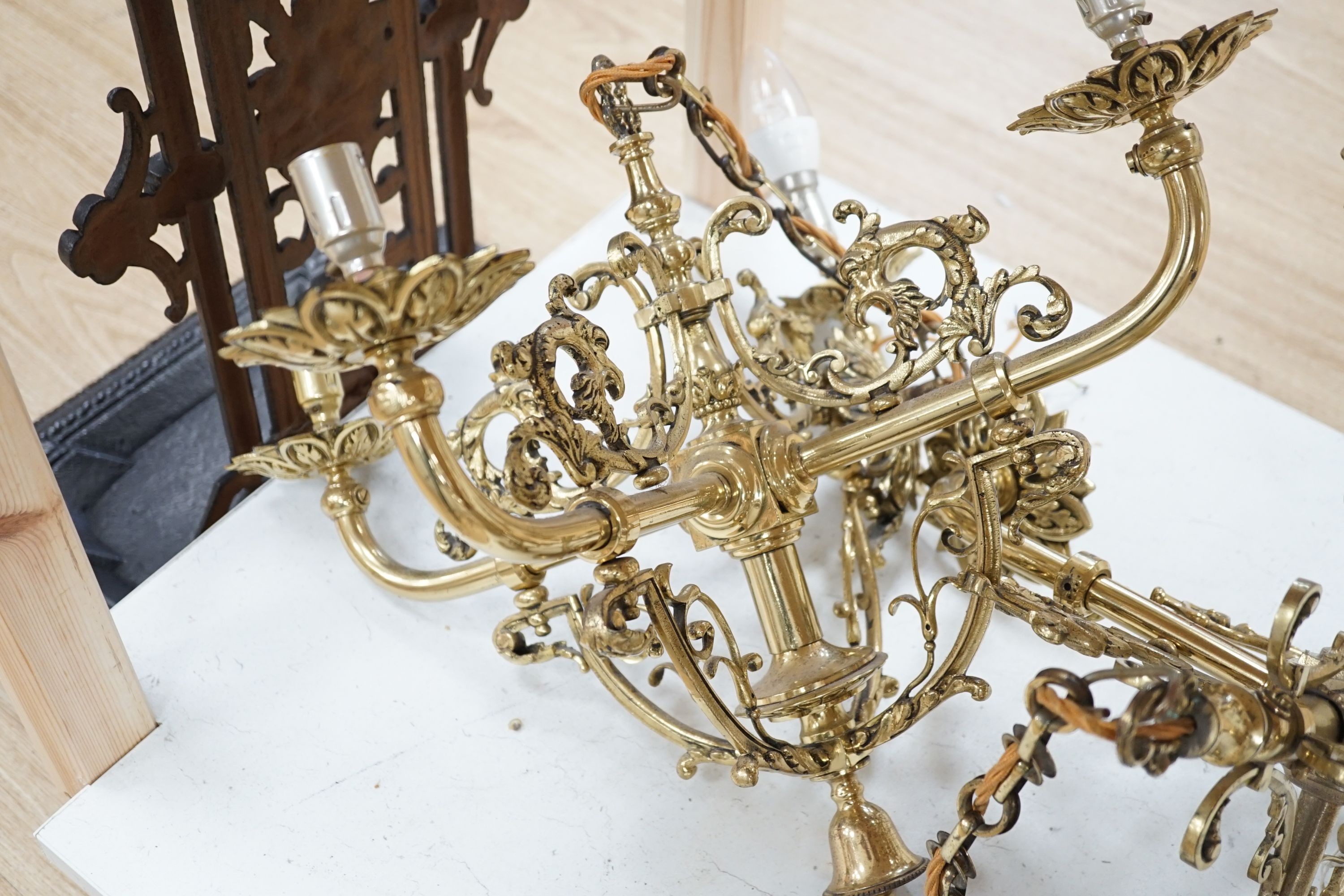 A pair of brass four light ceiling fittings, 41cm high